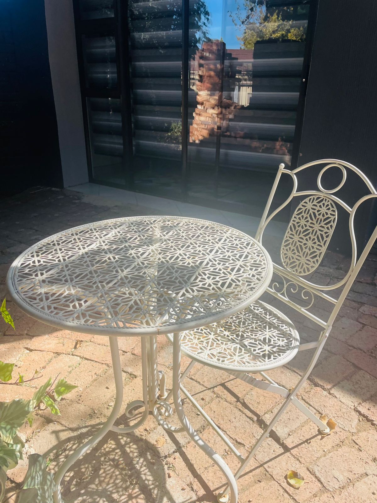 Vintage bistro table and chair on the patio